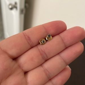 Small rose gold studs with dark stones